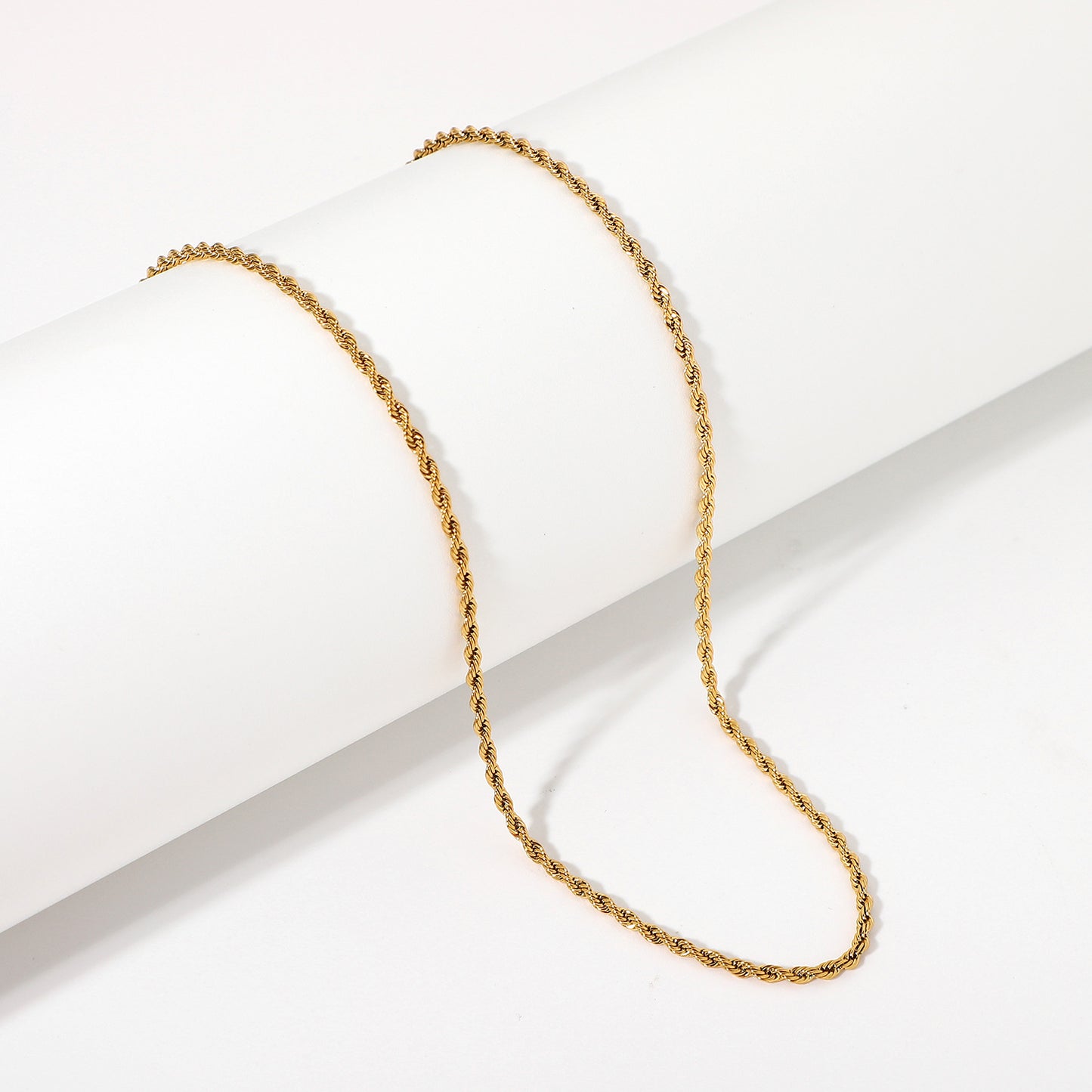 Gold rope chain necklace on a white background - from Aurie Jewelry essentials collection