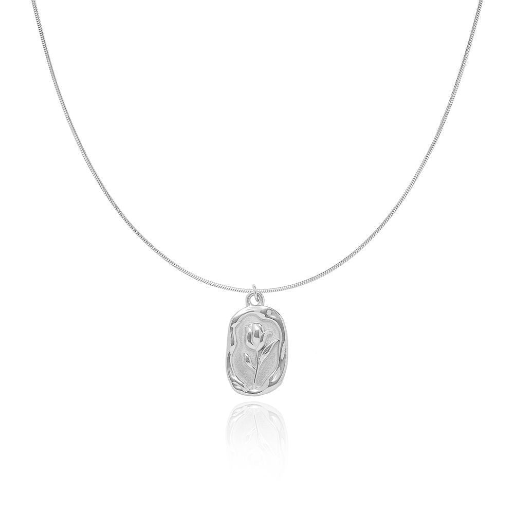 Silver tulip embedded pendent on a snake chain on a white background from the The Aurie Jewelry Luna collection