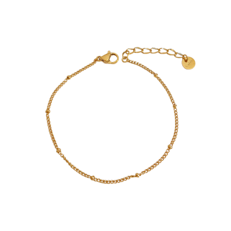 Gold ball bracelet on a white background - from Aurie Jewelry essentials collection
