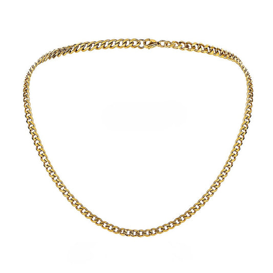Gold cuban chain necklace on a white background - from Aurie Jewelry essentials collection 