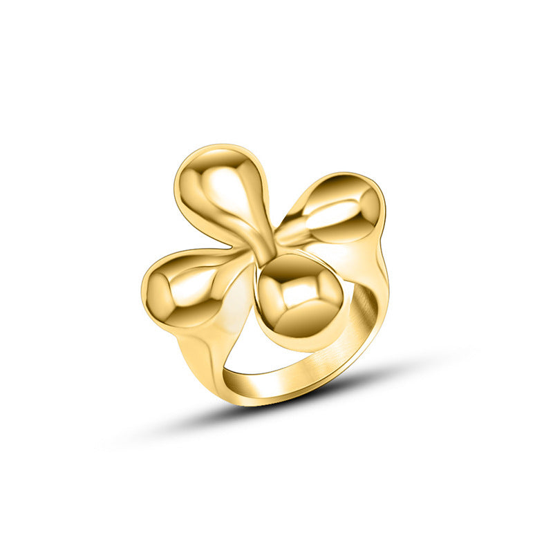 Gold bow flower shaped ring on a white background - from Aurie Jewelry bestie collection 