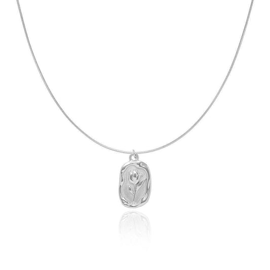 Silver tulip embedded pendent on a snake chain on a white background from the The Aurie Jewelry Luna collection 