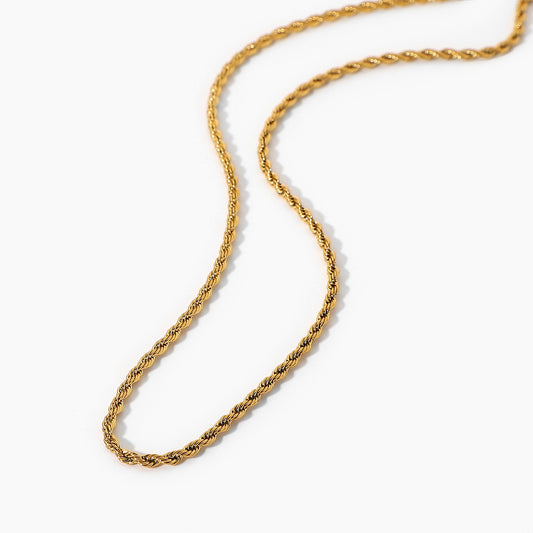 Gold rope chain necklace on a white background - from Aurie Jewelry essentials collection 