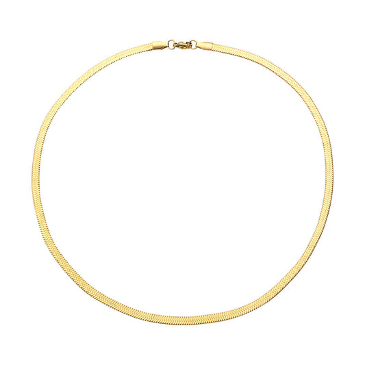 Gold snake necklace on a white background - from Aurie Jewelry essentials collection 