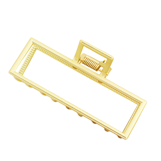 Gold hair clip on a white background