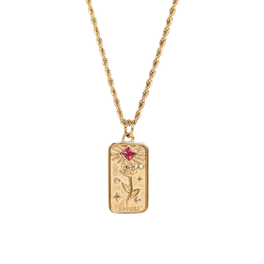 Gold necklace with a rectangular pendant featuring a red gemstone on a white background - from Aurie Jewelry bestie collection 
