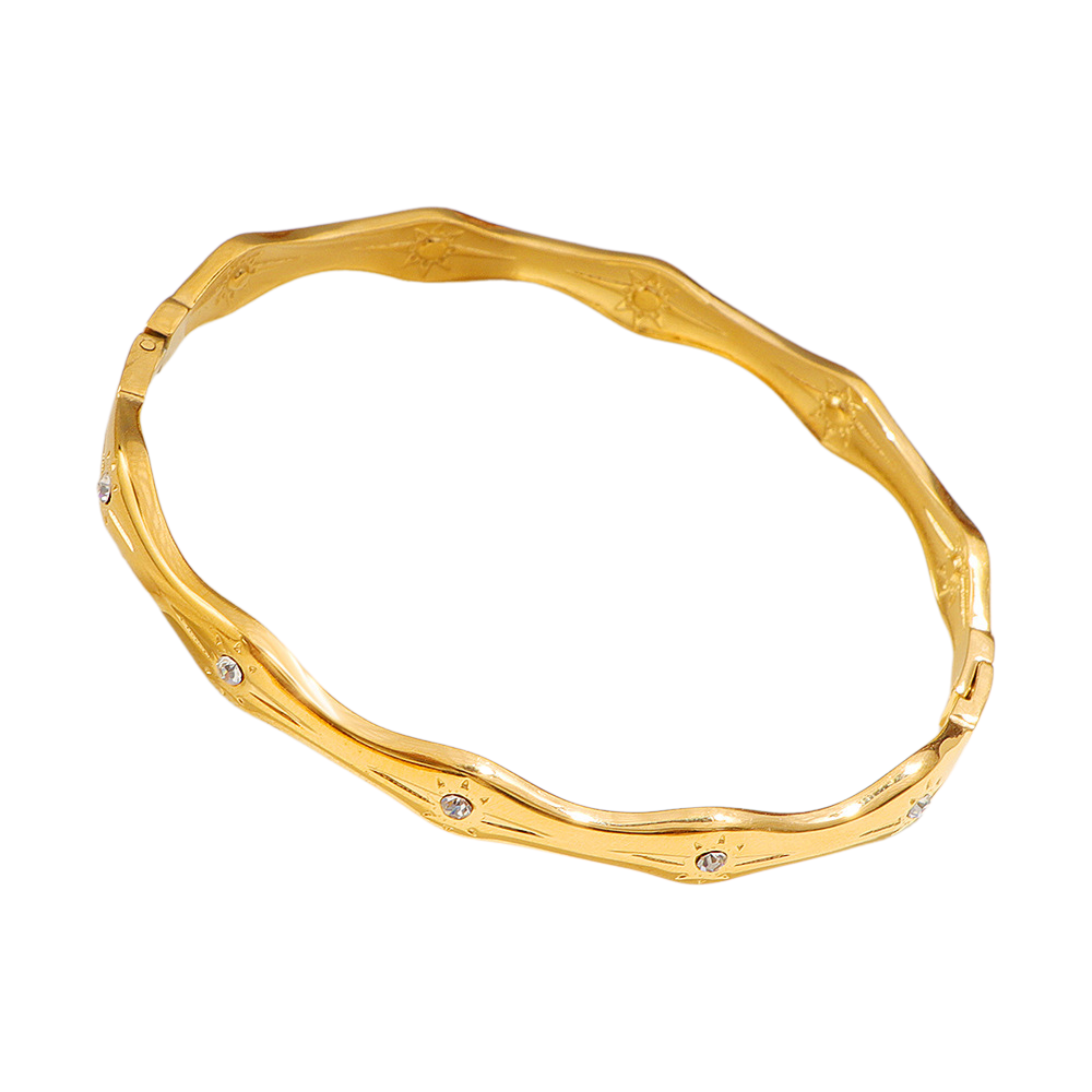 Gold bracelet with a white background