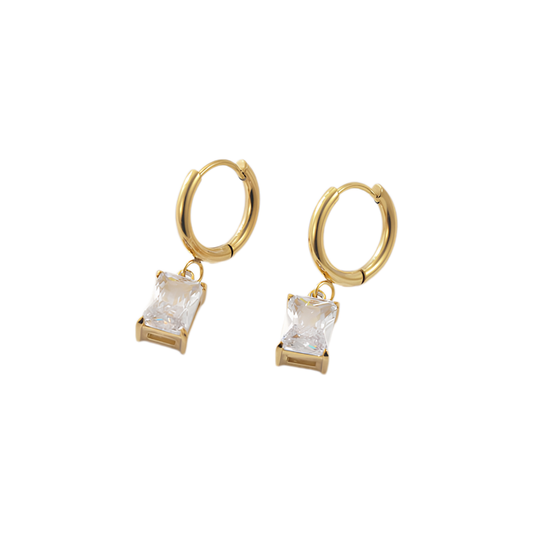 Gold hoop earrings with clear gemstones on a white background